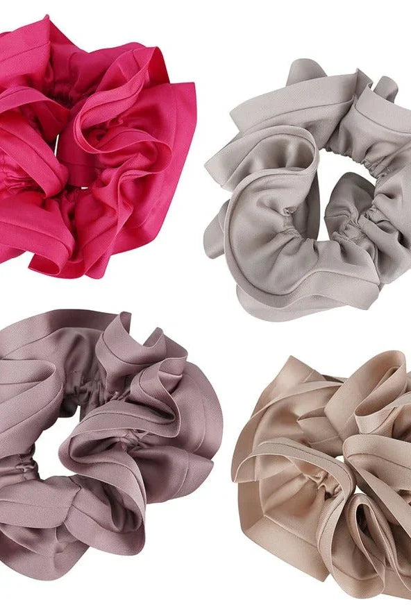 Set of four ruffled fabric scrunchies in pink, beige, taupe, and cream from Love Classic