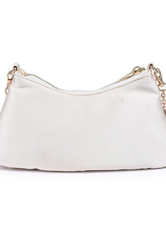 Compact opalite-inspired evening bag featuring a shimmering surface that reflects light beautifully while holding essentials for special events.