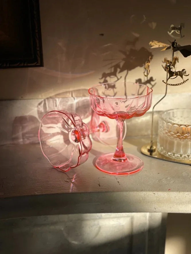 Vintage pink glass cups on a table with carousel decor, Love Classic elegant style