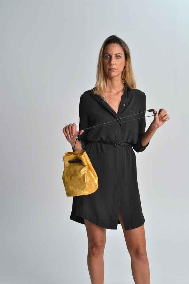 Woman in black dress holding yellow leather bag, Love Classic fashion style