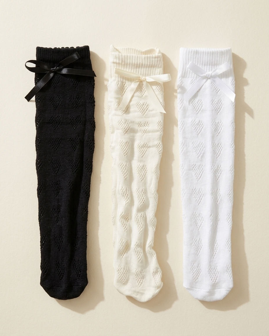3-Pack Heart-Shaped Lace Bow Socks flat lay in Black, Milk White and White with satin bows