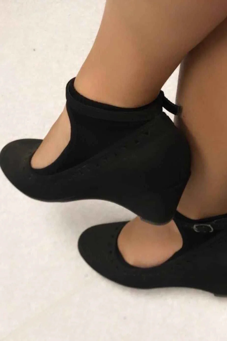 Black ankle strap wedge shoes on feet, classic style from Love Classic