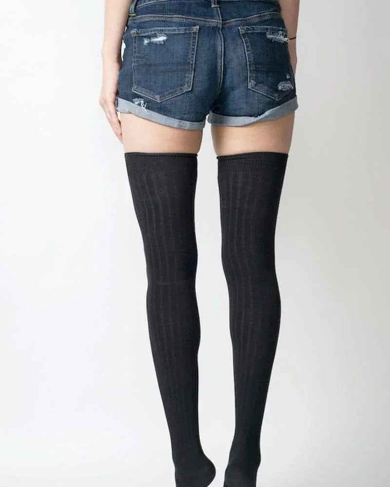 Woman in denim shorts wearing black over-the-knee socks, Love Classic fashion style