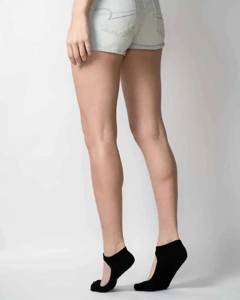 Woman modeling light denim shorts and black ballet grip socks, Love Classic fashion