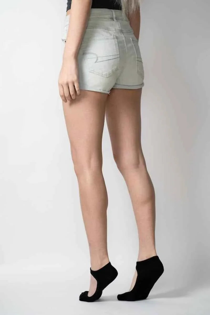 Woman modeling light denim shorts and black ballet grip socks, Love Classic fashion