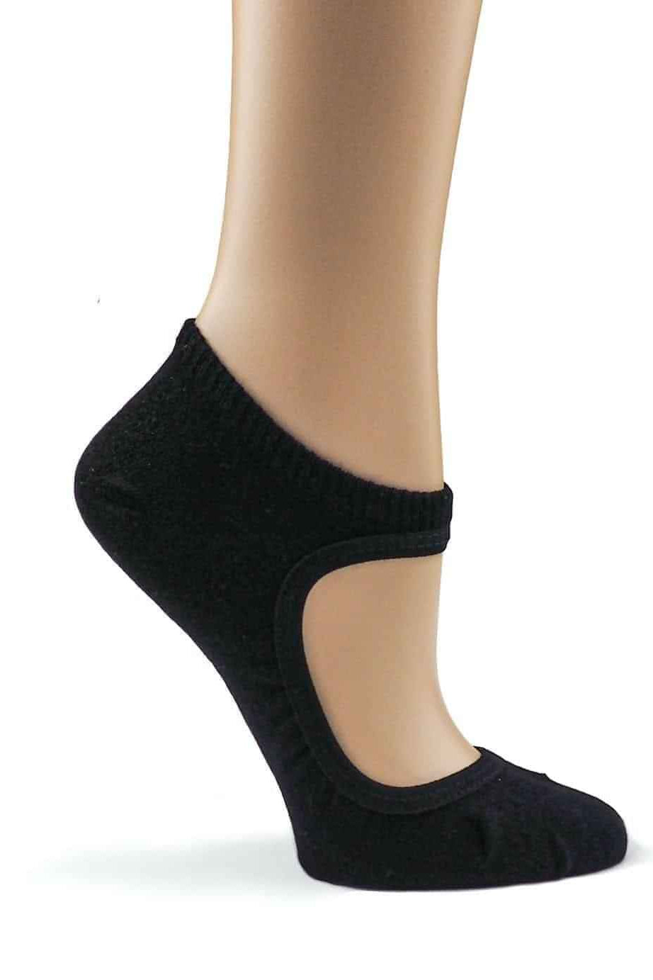 “Black ballet-cut no-show sock on a model’s foot, featuring a low curved opening and soft knit material.”