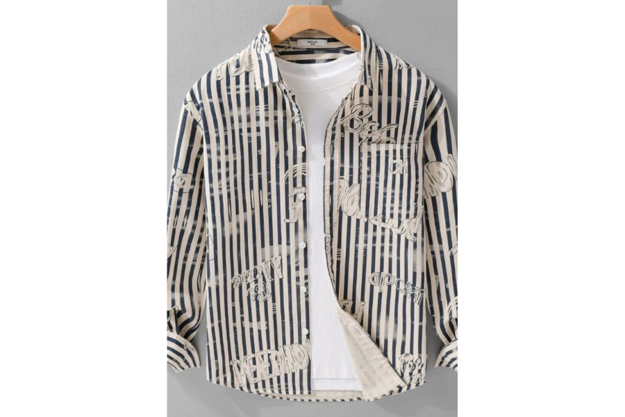 Men’s button-up shirt with navy and beige vertical stripes and graphic text, displayed on hanger