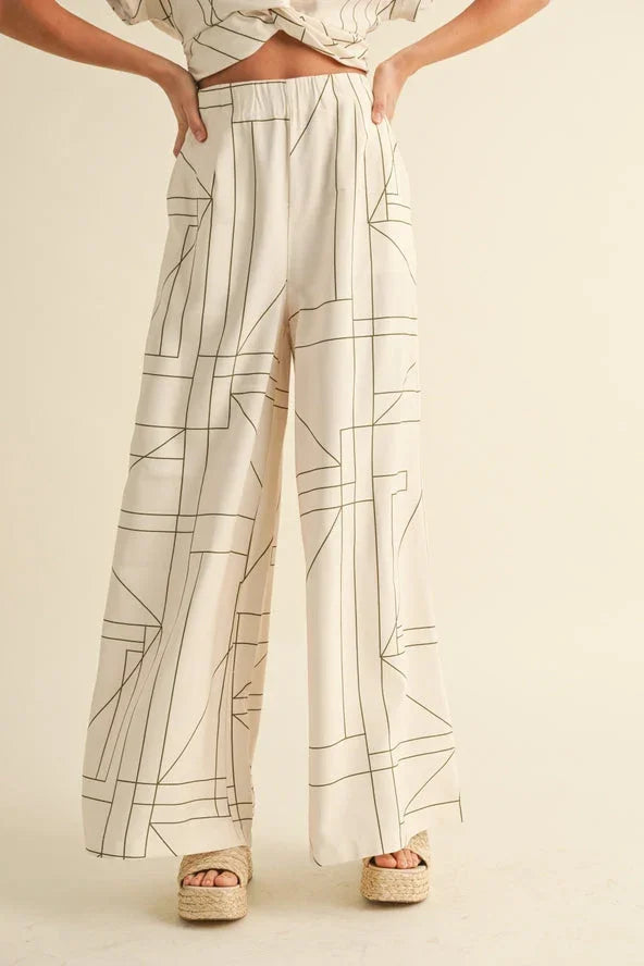Beige wide-leg trousers with black geometric lines, stylish women's fashion from Love Classic