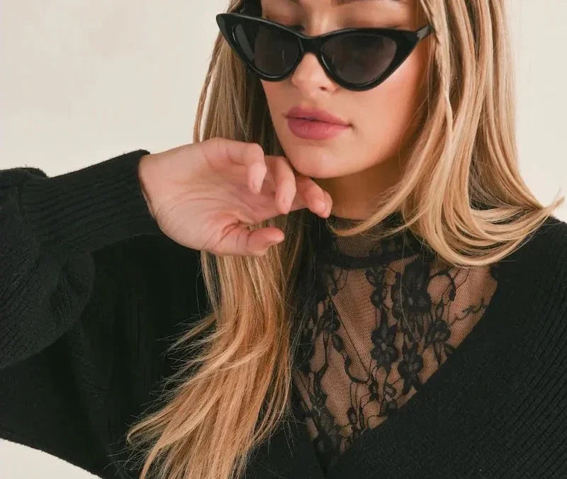 Woman in chic black cat eye sunglasses and lace top, Love Classic fashion style