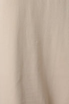 Detailed close-up of the taupe Round Neck Lace Joined T-Shirt Maxi Dress highlighting the contrast between smooth bodice fabric and sheer lace texture.