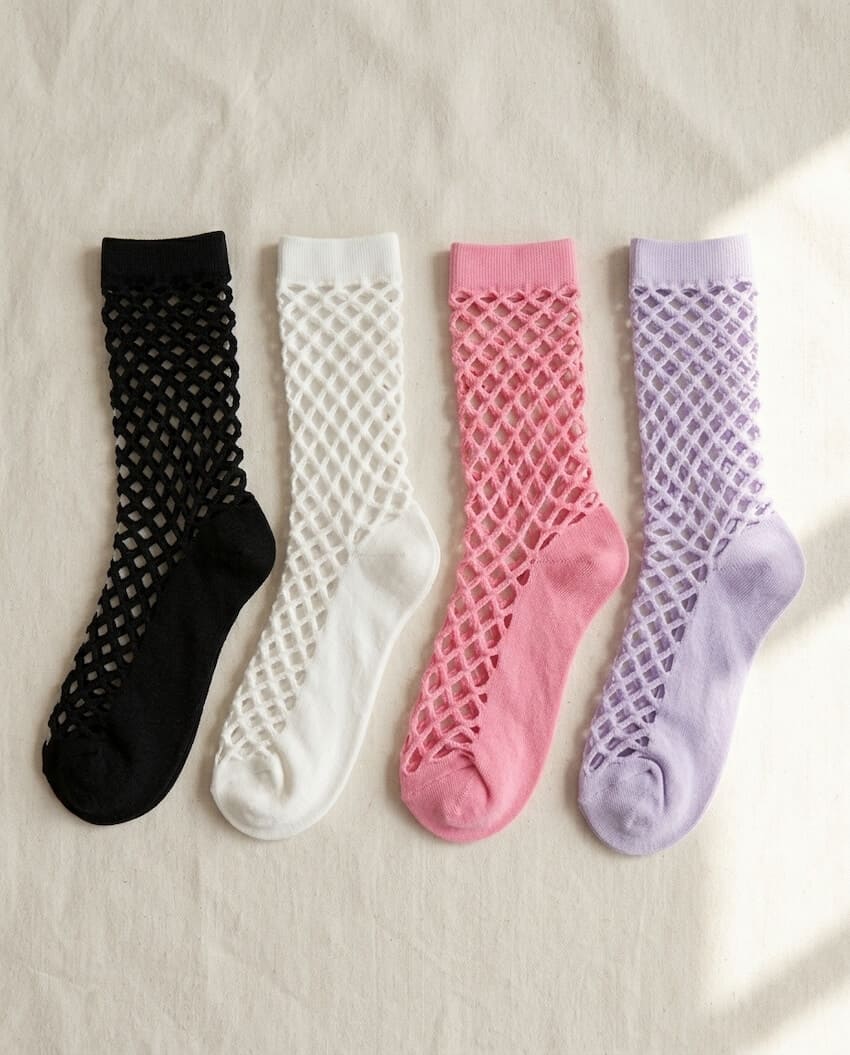 Bundled Pack, Midnight Lattice Fishnet Socks featuring breathable fishnet knit construction with flexible stretch support and assorted color variations in black, white, pink, and lavender, displayed on a soft fabric background to highlight versatile styling options and lightweight comfort.