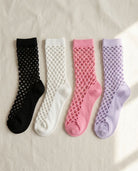 Bundled Pack, Midnight Lattice Fishnet Socks featuring breathable fishnet knit construction with flexible stretch support and assorted color variations in black, white, pink, and lavender, displayed on a soft fabric background to highlight versatile styling options and lightweight comfort.