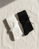 Bundled Pack, Midnight Lattice Fishnet Socks featuring breathable open mesh construction with a flexible crew fit and soft stretch comfort, worn in a lavender color variation beside a poolside setting with casual sneakers, highlighting lightweight comfort and relaxed seasonal styling.