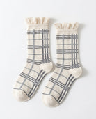 Eyelet Trim Cuff Plaid Crew Socks featuring a breathable crew length construction with elegant plaid pattern accents and scalloped eyelet trim cuffs, displayed flat on a clean white background to highlight the detailed knit texture and soft everyday comfort.