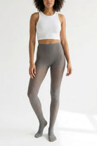 Lightweight Semi Opaque Tights in soft gray, featuring a smooth semi-sheer finish with gentle stretch and high-waisted fit, shown full-length on a model in a clean studio setting.