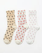 3-Pack Blushing Hearts Sheer Socks featuring three sheer ankle socks with black heart, red heart and soft dot accents, displayed flat on a clean studio background, highlighting the assorted pack variety and lightweight translucent finish.