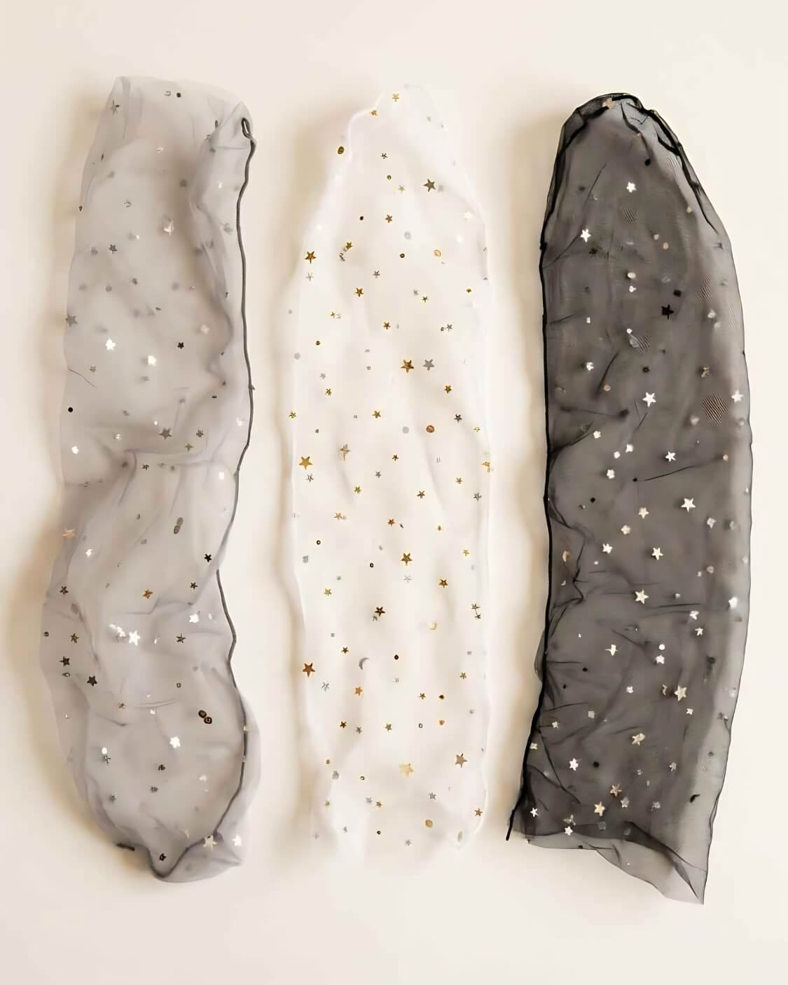 3-Pack Star Soft Tulle Mesh Sheer Socks featuring three transparent mesh sock styles with sparkling metallic star patterns and soft lightweight tulle texture, displayed flat in black, white, and grey variations to highlight the delicate finish and versatile everyday styling options.