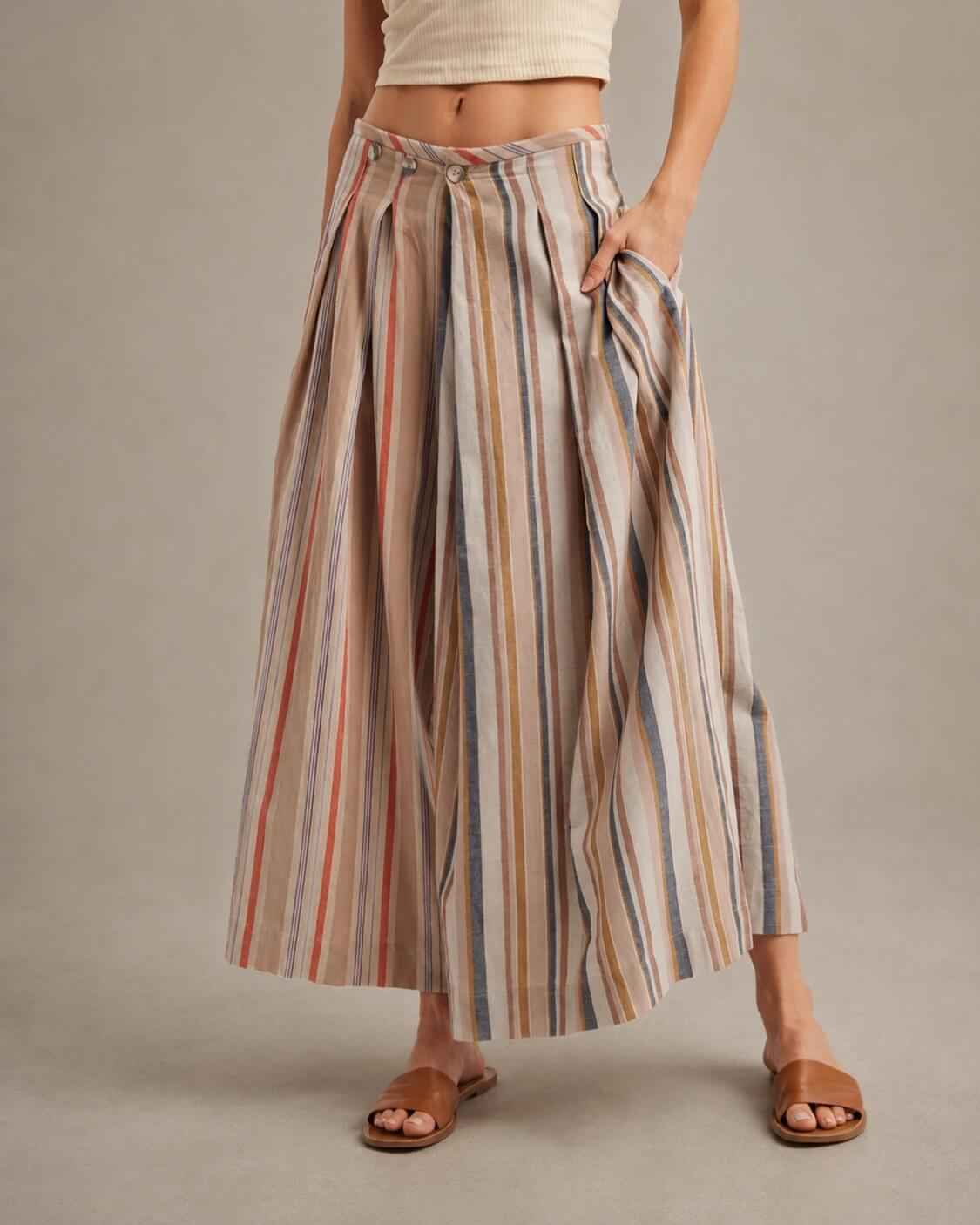 Multi-Stripe Pleated Front Wide-Leg Pants featuring a flowing wide-leg silhouette with soft vertical stripe detailing and front pleats, styled with flat slide sandals in a neutral studio setting, highlighting the relaxed drape and comfortable everyday movement.