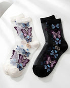Butterfly Sheer Socks 2-Pack featuring two color options in sheer mesh fabric with detailed butterfly embroidery, displayed flat on a clean white surface.