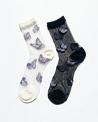 Butterfly Dreams Sheer Socks Bundle Pack featuring two sheer ankle socks with embroidered butterfly motifs, contrasting cuff and toe panels, displayed flat on a clean studio background, highlighting the light translucent finish and playful butterfly pattern.