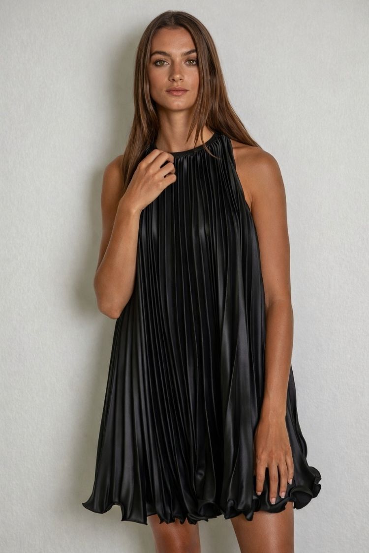 Woman wearing a pleated black halter mini dress, Love Classic high quality fashion