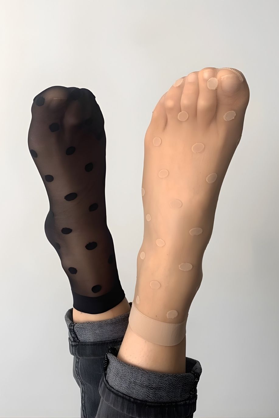 2-Pack Sheer Polka Dot Socks featuring a lightweight transparent knit with soft stretch fit and playful dotted pattern, shown on raised feet with one black and one nude pair side by side, highlighting contrast and a clean minimal indoor setting.