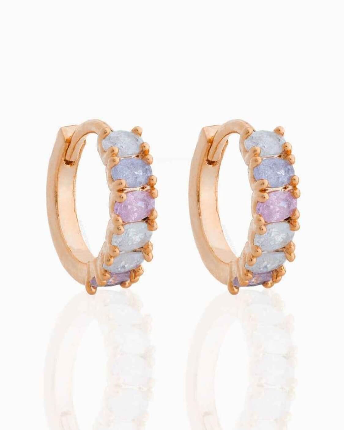 Dreaming About You Hoops featuring small hinged hoop earrings with pastel oval stone accents and gold tone prong setting, captured on a clean reflective backdrop, highlighting curved shape, delicate shine, and gift ready presentation.