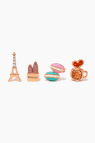 Café de Paris Stud Set, front product view showing Eiffel Tower, baguette bag, stacked macarons, and coffee cup studs in a polished gold tone with colorful enamel details.