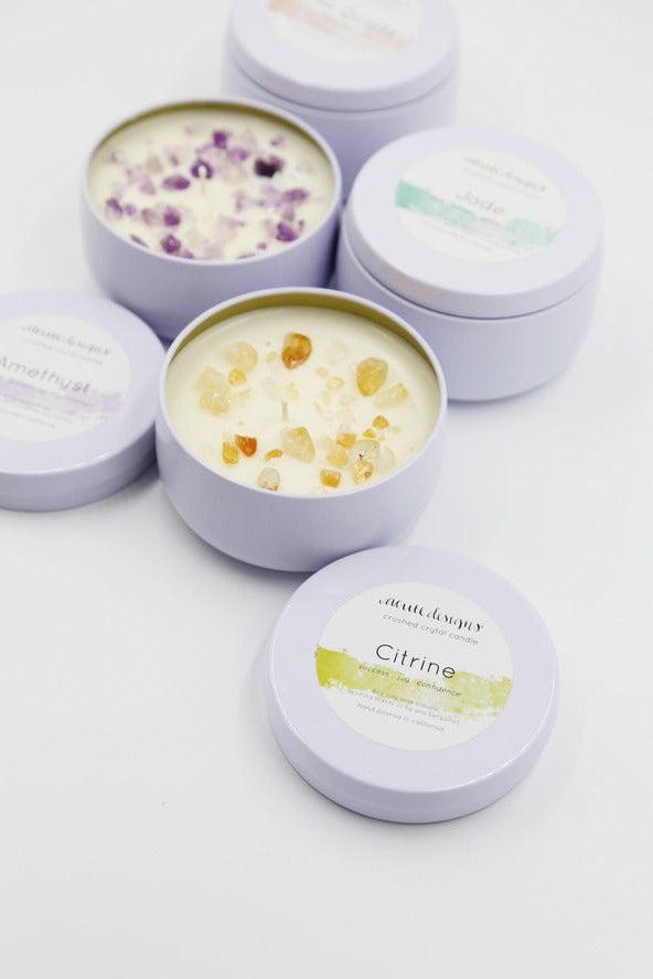 Love Classic gemstone candles in lavender tins, featuring amethyst, jade, and citrine styles.