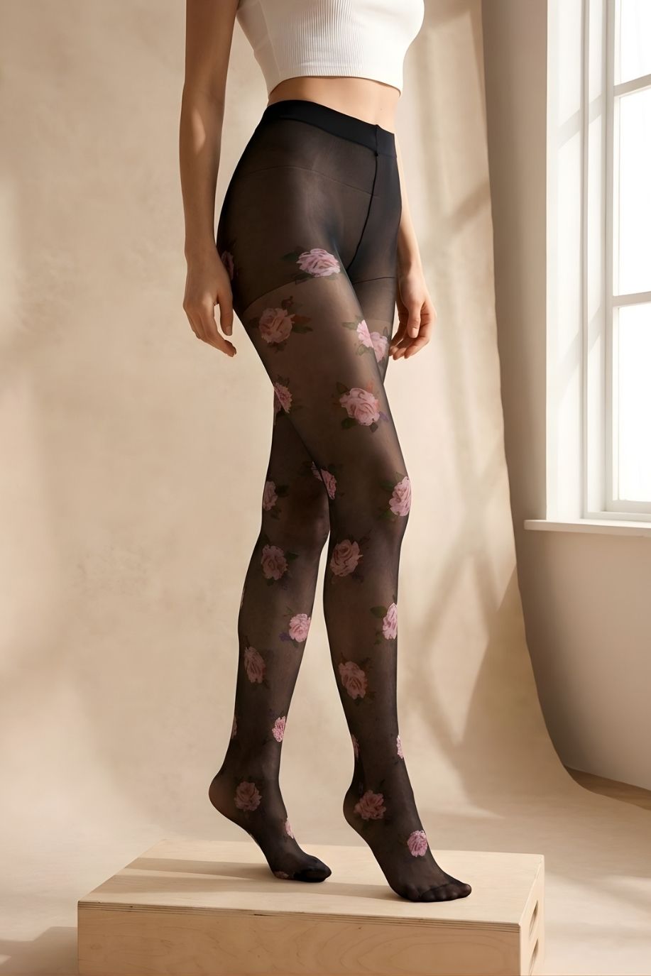 Romantic Rose Print Sheer Tights featuring a sheer black finish with delicate floral print and elastic waistband, shown in a side view highlighting the leg contour and smooth fit against soft natural light.