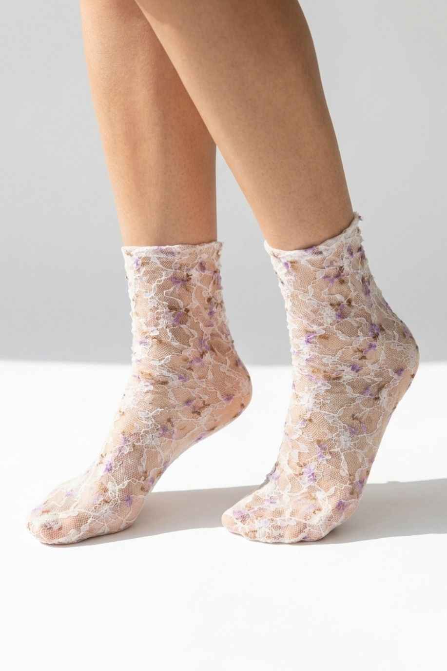 Floral Mesh Sheer Socks in purple floral lace mesh, worn on both feet to show the sheer texture and delicate pattern.