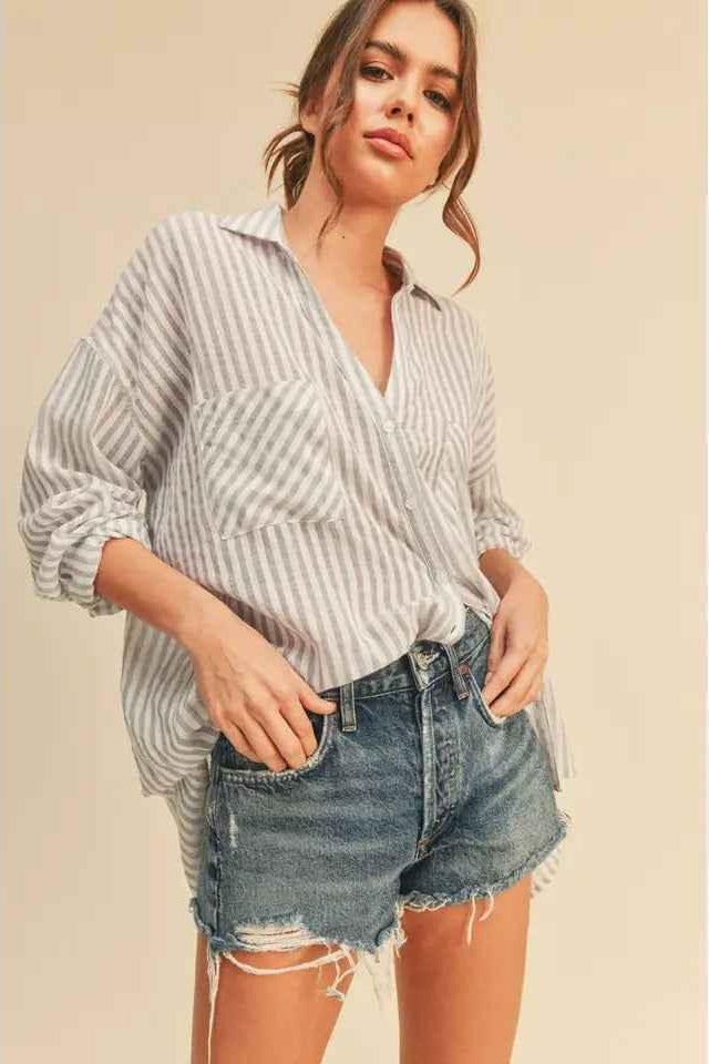 Woman wearing striped button-up shirt and denim shorts, Love Classic casual style