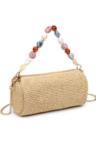 Natural Rachel Straw Clutch in a light woven finish with statement bead accents and polished metal hardware for versatile styling.