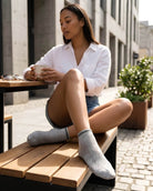 5-Pack Low Rise Diamond Lace Pattern Socks featuring breathable woven detailing with a flexible low rise fit and subtle stripe accents, worn while relaxing at an outdoor café table, highlighting soft comfort and versatile casual styling for daily use.