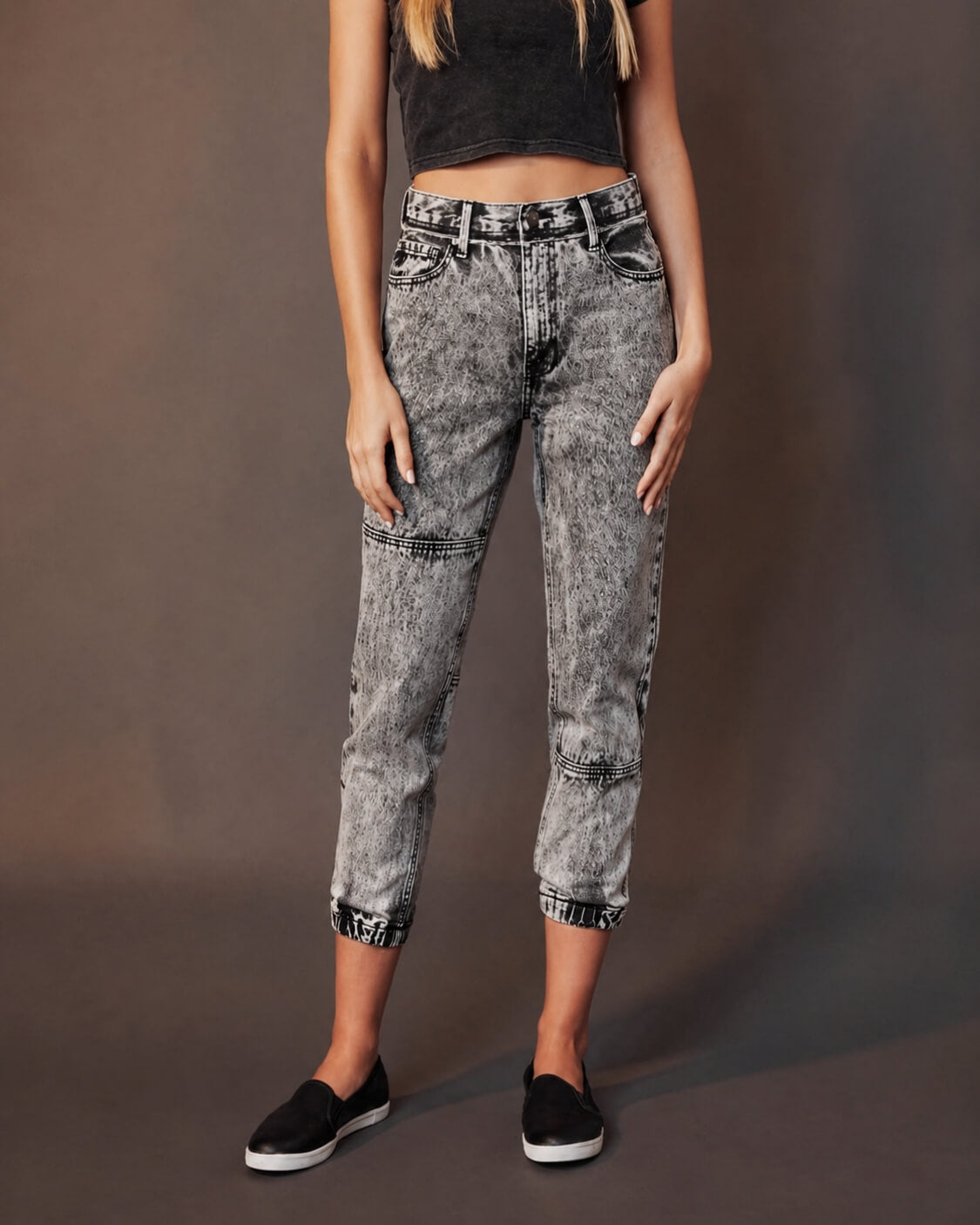 Woman wearing high-waisted acid wash jeans and black crop top, Love Classic fashion style