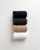 Bundled Packs Rosalie Lace Sheer Socks featuring raised wavy lace texture and delicate ruffled trim, stacked neatly in rolled layers on a clean white background, highlighting the assorted pack variety and soft sheer appearance.
