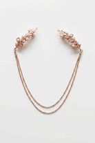 Bloom Bouquets Hair Chain featuring a rose gold-tone design with intricate leafy combs, petite pearl-like embellishments, and double cascading chains, displayed flat on a neutral background to highlight its soft shimmer and feminine, ethereal style.