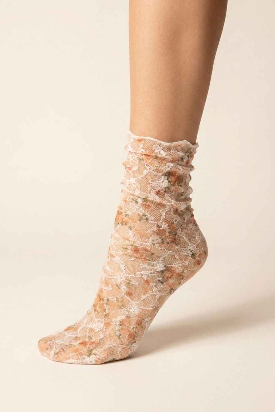 Floral Mesh Sheer Socks in orange floral lace mesh, shown on one foot against a soft neutral background.