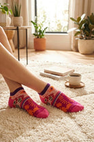 Shine Ultra-Short Ankle Socks featuring a snug ankle-length fit with bold pink, orange, and purple floral motifs, styled in a warm indoor setting with natural light, showcasing comfort and playful everyday appeal.