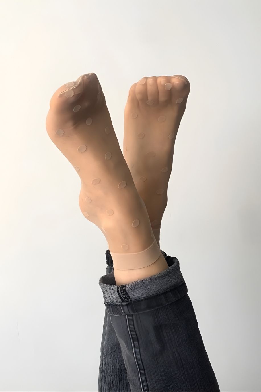 2-Pack Sheer Polka Dot Socks featuring a sheer nude finish with subtle polka dot detailing and flexible fit, displayed on crossed raised feet, highlighting softness, light appearance, and everyday versatility.
