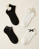 4-Pack Satin & Polka Dot Bow Ankle Socks flat lay: black and white socks with polka dot bows and black satin bows