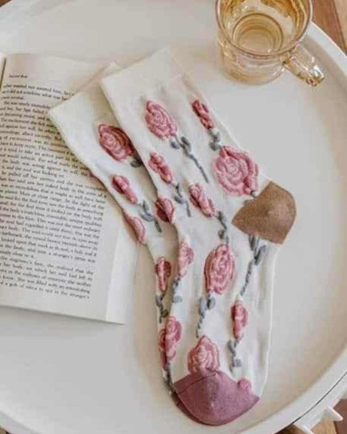 3-Pack Bouquet Flower Crew Sock featuring a soft floral inspired collection with rose patterns, delicate botanical prints, and textured blossom detailing, styled on a neutral tray beside an open book and glass cup, highlighting cozy vintage charm and feminine everyday styling.