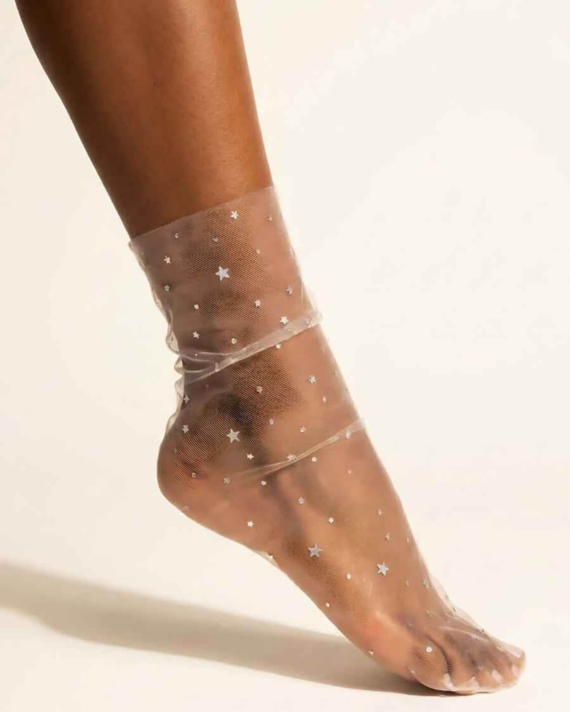 Star Soft Tulle Mesh Sheer Socks featuring ultra sheer tulle mesh with scattered star patterns and a smooth flexible fit, displayed in a close-up studio shot to emphasize the lightweight texture and delicate transparent finish.