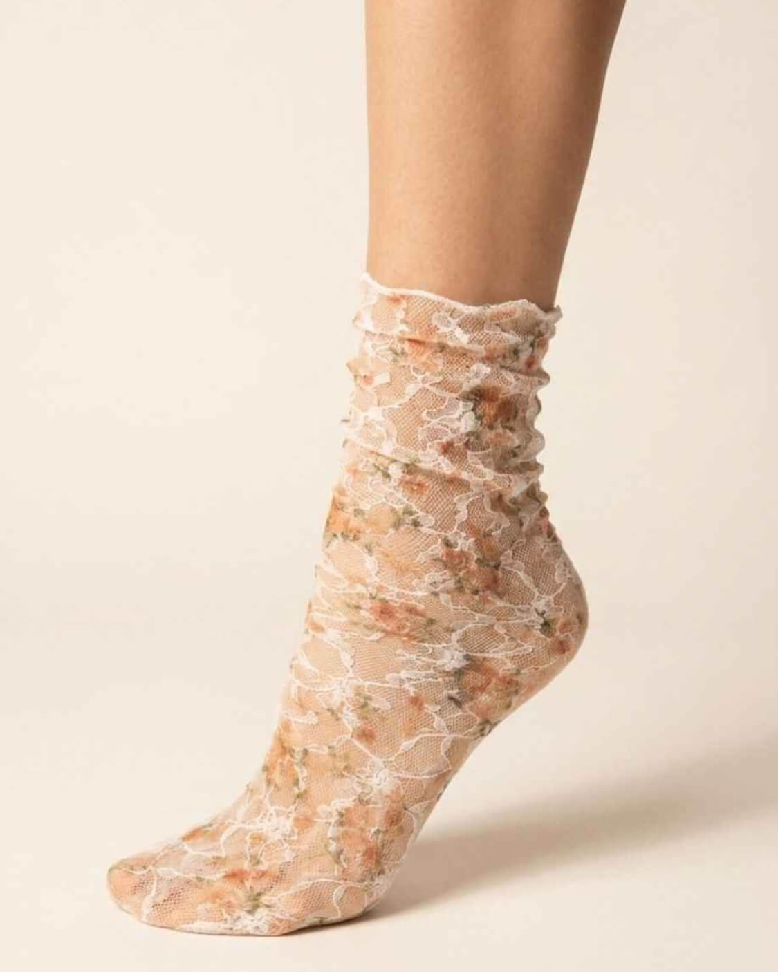 Floral Mesh Sheer Socks featuring transparent stretch mesh with delicate orange floral lace patterns and a softly gathered ankle fit, displayed in a close-up studio setting to highlight the lightweight texture, breathable comfort, and elegant vintage-inspired styling.