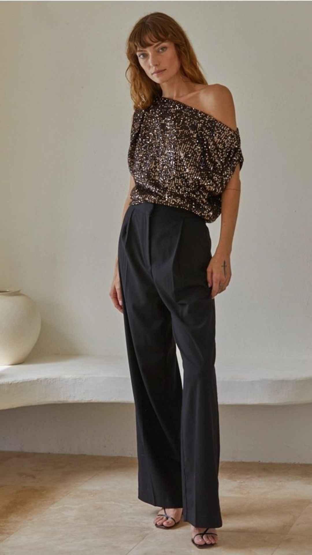 Woman in sequined off-shoulder top and black wide-leg pants, Love Classic fashion style