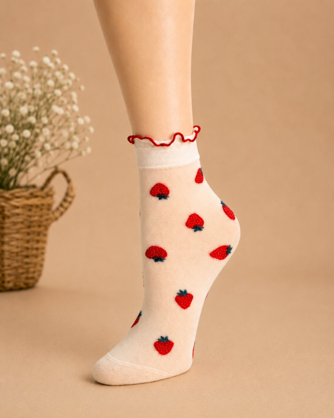 Whimsical Ruffle Edge Sheer Socks featuring a translucent ankle-length profile with strawberry motifs and a contrasting ruffle edge, displayed in a close-up studio setting to highlight the lightweight fabric, detailed pattern, and comfortable stretch fit.