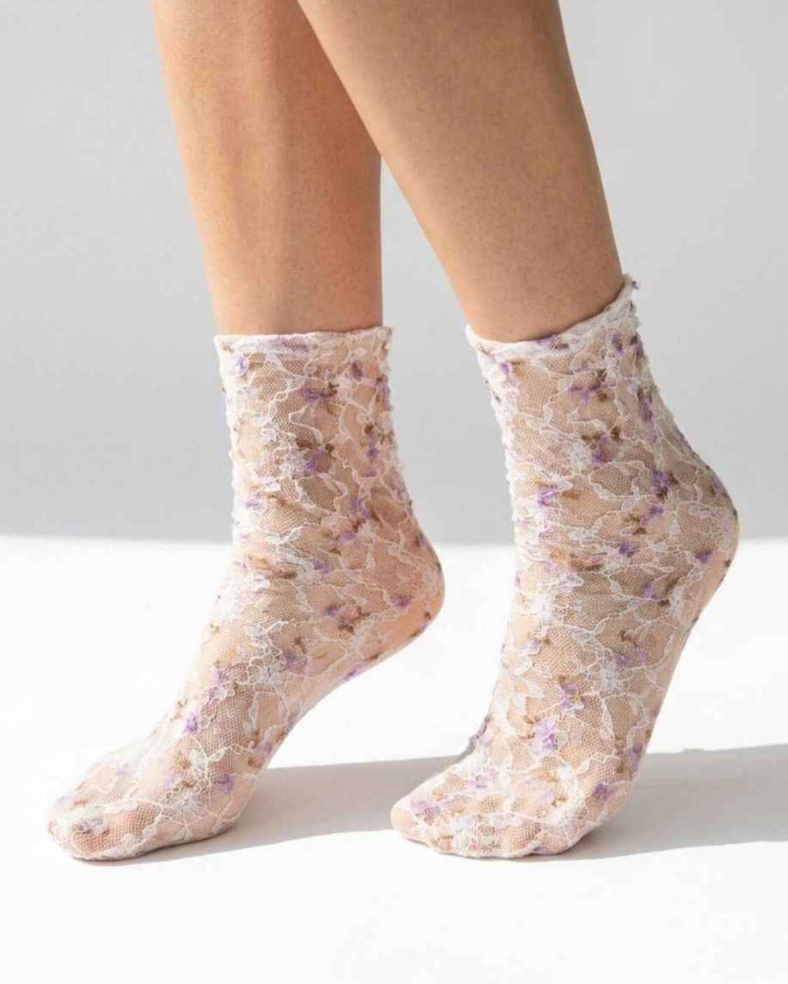 Floral Mesh Sheer Socks in purple floral lace mesh, worn on both feet to show the sheer texture and delicate pattern.
