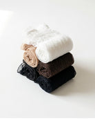 Bundled Packs Rosalie Lace Sheer Socks featuring translucent lace texture, rolled construction and ruffled cuff detailing, stacked in a compact layered bundle on a bright studio background, highlighting the soft finish and multi-pair pack presentation.