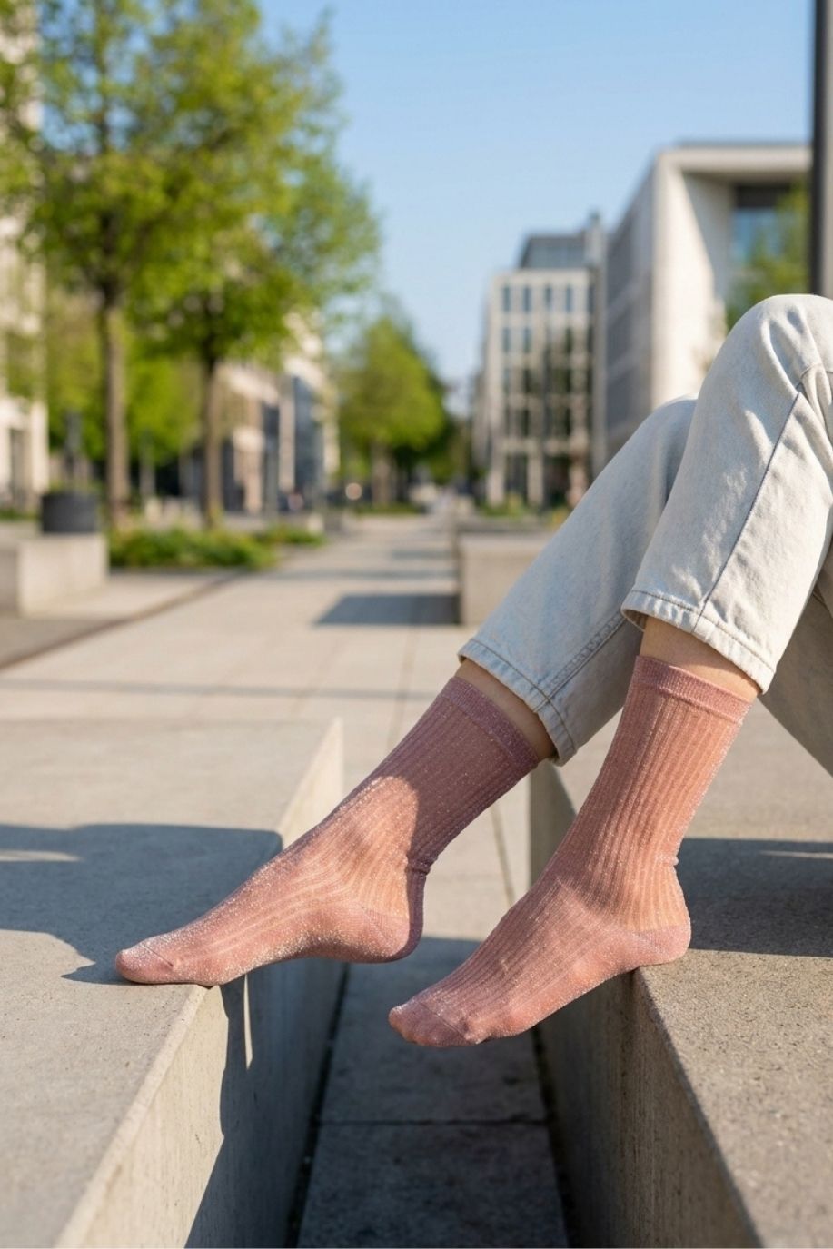 Sheer Metallic Ribbed Crew Socks in dusty pink with metallic sparkle, styled with light denim on an outdoor bench, emphasizing the breathable sheer texture and subtle ribbed pattern.