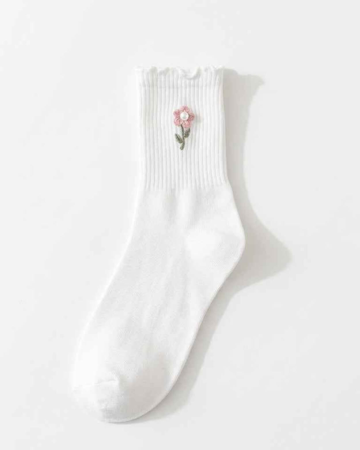 3-Pack Blush Pearl Rose Ruffle Crew Socks featuring a ribbed crew sock with a ruffled cuff and flower embroidery accent, displayed flat against a bright studio background, highlighting the soft structure, ankle coverage, and delicate decorative finish.